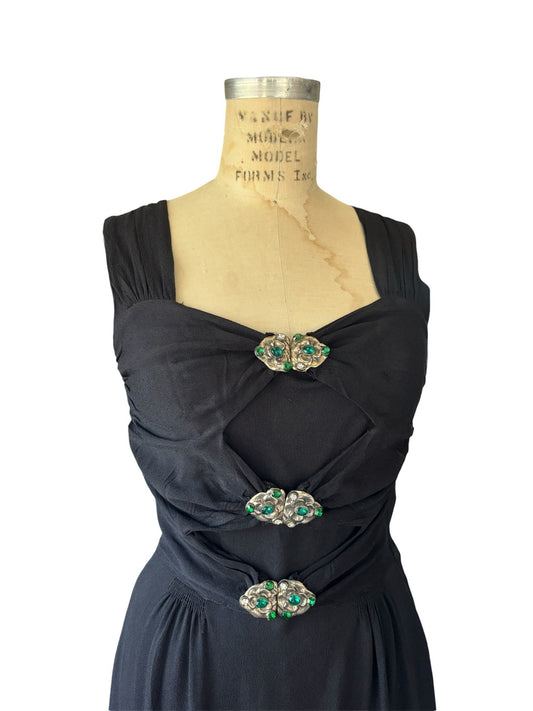 1940s inky black cutout dress with emerald rhinestone encrusted clasps
